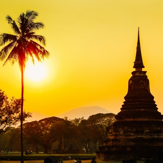 Sonnenuntergang am Geschichtspark Sukhothai